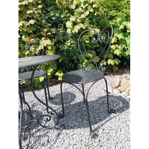 951 - Wrought iron garden table with three matching chairs {Tbl. 65 cm H x 65 cm Dia. and Chairs 82 cm H x... 