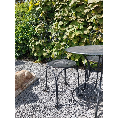 951 - Wrought iron garden table with three matching chairs {Tbl. 65 cm H x 65 cm Dia. and Chairs 82 cm H x... 