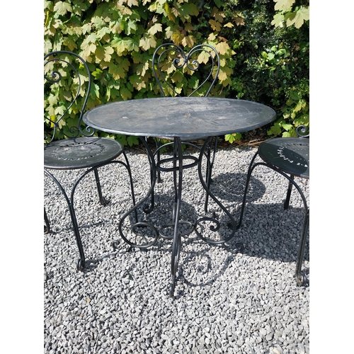 951 - Wrought iron garden table with three matching chairs {Tbl. 65 cm H x 65 cm Dia. and Chairs 82 cm H x... 