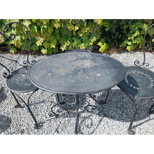 951 - Wrought iron garden table with three matching chairs {Tbl. 65 cm H x 65 cm Dia. and Chairs 82 cm H x... 