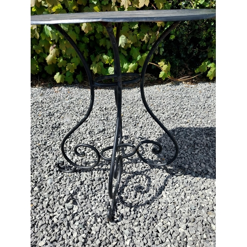 951 - Wrought iron garden table with three matching chairs {Tbl. 65 cm H x 65 cm Dia. and Chairs 82 cm H x... 