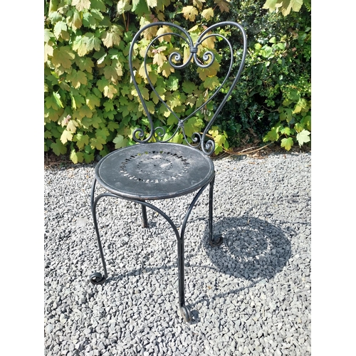 951 - Wrought iron garden table with three matching chairs {Tbl. 65 cm H x 65 cm Dia. and Chairs 82 cm H x... 