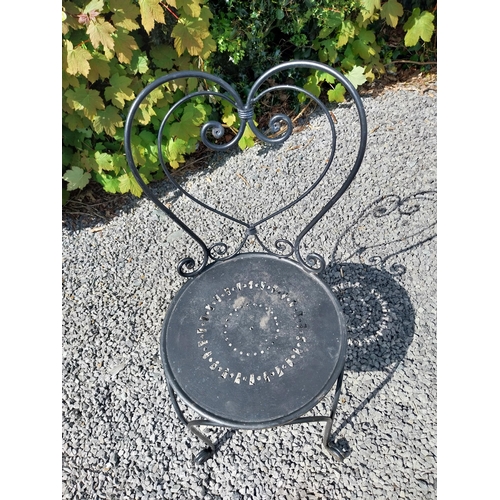 951 - Wrought iron garden table with three matching chairs {Tbl. 65 cm H x 65 cm Dia. and Chairs 82 cm H x... 