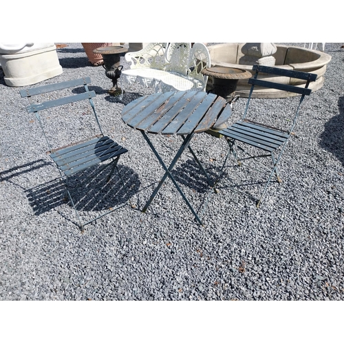 959 - Wooden and metal garden table with two matching chairs {Tbl. 71 cm H x 60 cm Dia. and Chairs 80 cm H... 