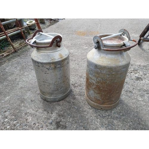 978 - Pair of aluminium creamery cans {57 cm H x 30 cm Dia.}.