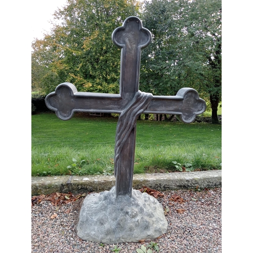 987 - Bronze cross mounted on stone base {H 125cm x W 90cm x D 40cm }. (NOT AVAILABLE TO VIEW IN PERSON)