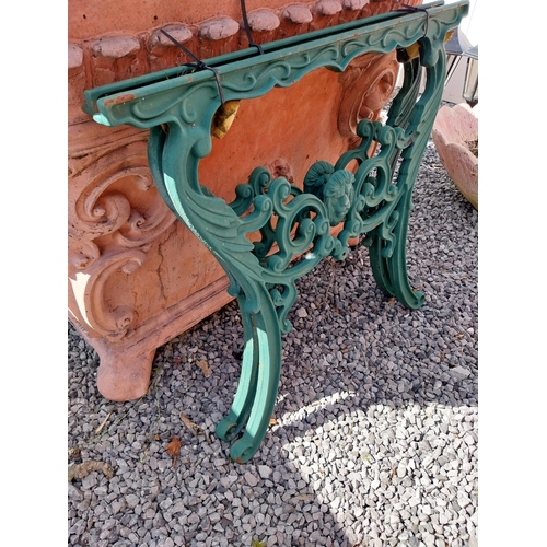 996 - Pair of cast iron seat ends {65 cm H x 68 cm W x 5 cm D}.