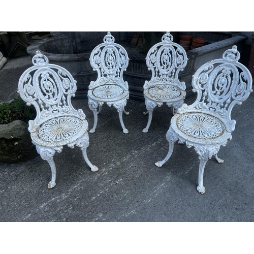 106 - Set of four 19th C. cast iron garden chairs {80cm H x 40cm W x 50cm D}