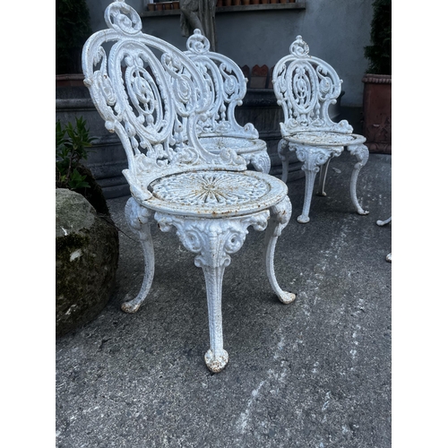 106 - Set of four 19th C. cast iron garden chairs {80cm H x 40cm W x 50cm D}