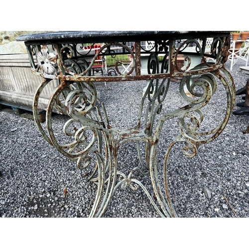 33 - Decorative wrought iron garden table with marble top {98cm H x 87cm Dia.}