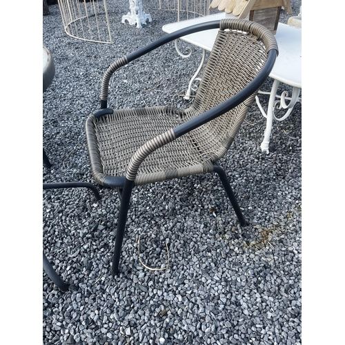 801 - Garden table and two rattan chairs {Table:70cm H x 60cm Dia. And Chairs: 76cm H x 54cm W x 56cm D}