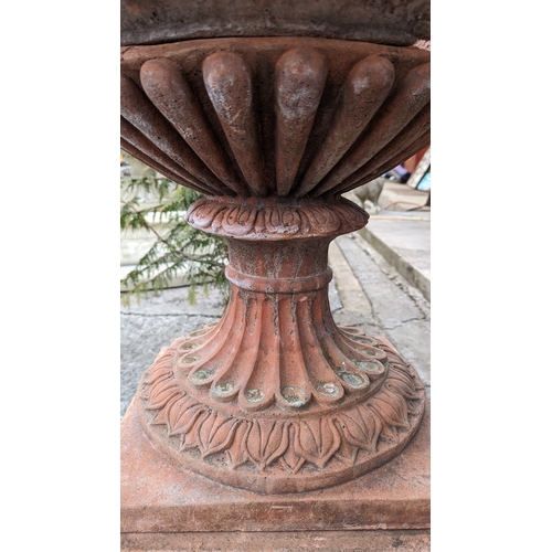 208 - Pair of exceptional quality English moulded terracotta urns decorated with floral swags and ladies m... 