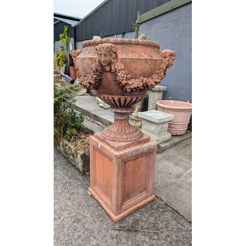 208 - Pair of exceptional quality English moulded terracotta urns decorated with floral swags and ladies m... 