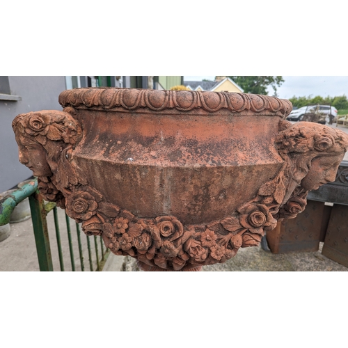 208 - Pair of exceptional quality English moulded terracotta urns decorated with floral swags and ladies m... 