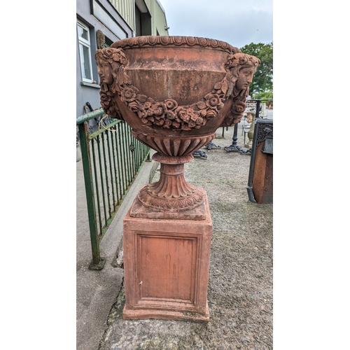 208 - Pair of exceptional quality English moulded terracotta urns decorated with floral swags and ladies m... 