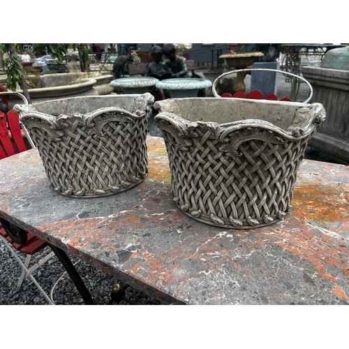 491 - Pair of good quality moulded stone wall planters {22cm H x 33cm W x 20cm D}