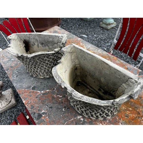 491 - Pair of good quality moulded stone wall planters {22cm H x 33cm W x 20cm D}