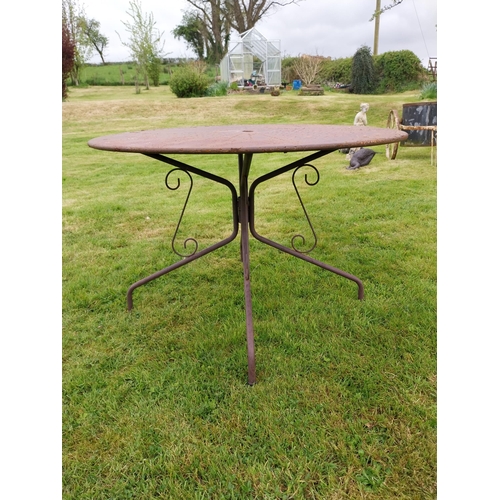 169A - Wrought iron garden table with four matching chais.