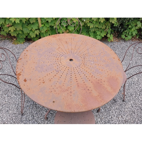 169A - Wrought iron garden table with four matching chais.