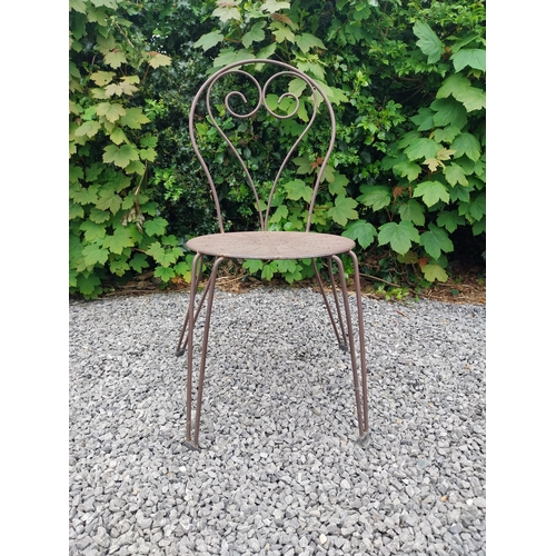 169A - Wrought iron garden table with four matching chais.