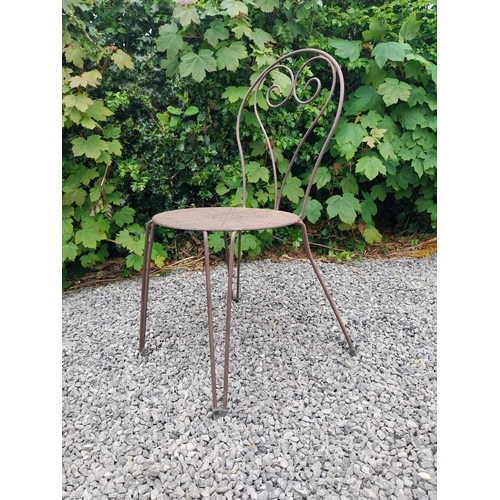 169A - Wrought iron garden table with four matching chais.