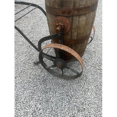 1031 - Early 20th C. metal bound oak water cart on cast iron wheels.