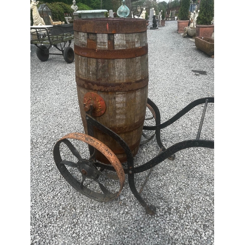 1031 - Early 20th C. metal bound oak water cart on cast iron wheels.