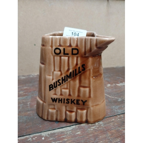 104 - Bushmills Whiskey Arklow advertising jug {12 cm H x 14 cm W x 12 cm D}.