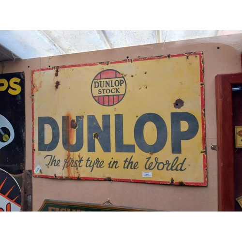 1057 - Dunlop Stock First Tyre in the World enamel advertising sign. {50 cm H x 75 cm W}.