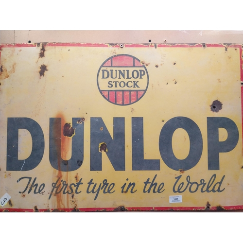 1057 - Dunlop Stock First Tyre in the World enamel advertising sign. {50 cm H x 75 cm W}.