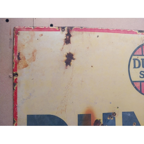 1057 - Dunlop Stock First Tyre in the World enamel advertising sign. {50 cm H x 75 cm W}.