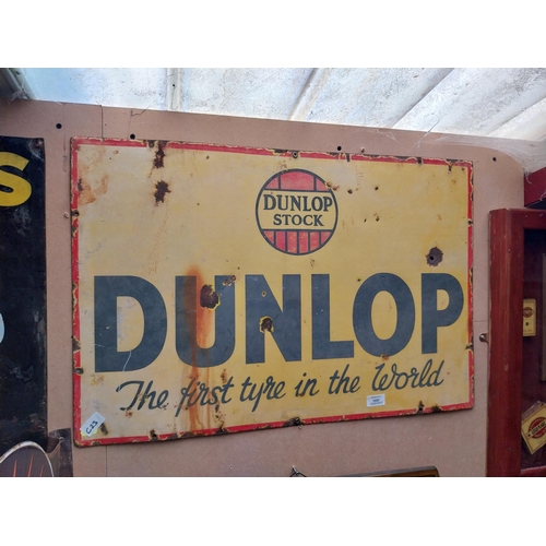 1057 - Dunlop Stock First Tyre in the World enamel advertising sign. {50 cm H x 75 cm W}.