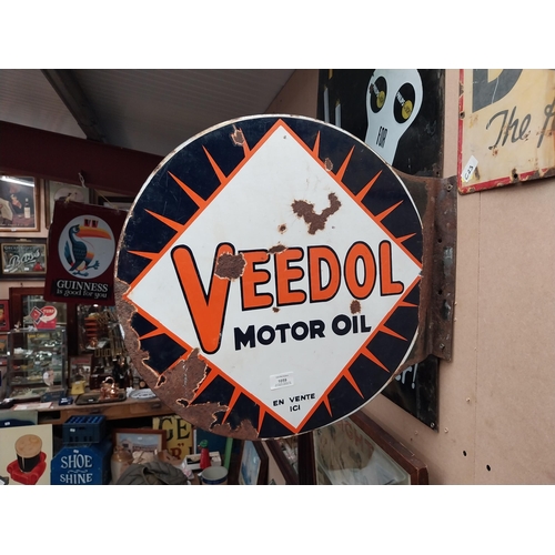 1059 - Veedol double sided enamel advertising sign. {40 cm H x 53 cm Dia.}.