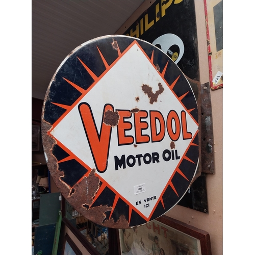 1059 - Veedol double sided enamel advertising sign. {40 cm H x 53 cm Dia.}.