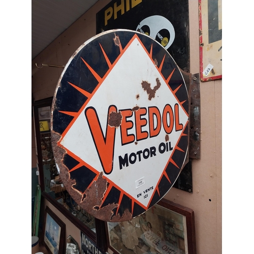 1059 - Veedol double sided enamel advertising sign. {40 cm H x 53 cm Dia.}.