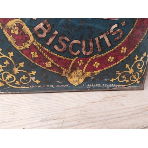 1065 - Huntley and Palmers Biscuit lidded advertising tin. {34 cm H x 34 cm W x 34 cm D}.