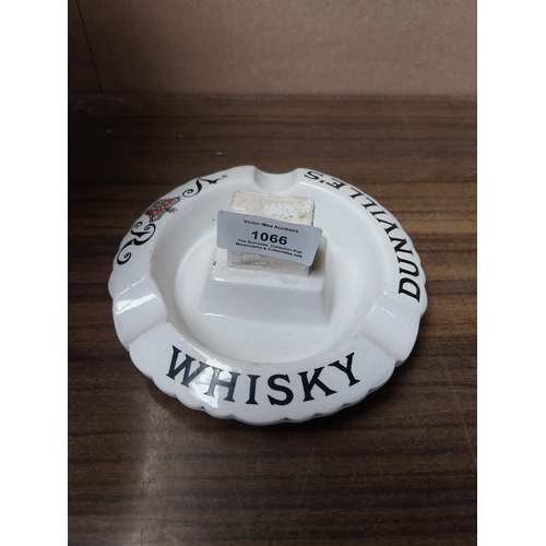 1066 - Dunville's whiskey ceramic ashtray and match strike Richard Patterson Belfast. {5 cm H x 13 cm W}.