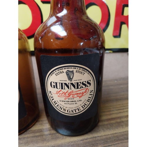 1080 - Three pint Guinness Bottles - O 'Dwyer Bros Pearse Street and Thomas Carr and Co. {21 cm H x 8 cm Di... 