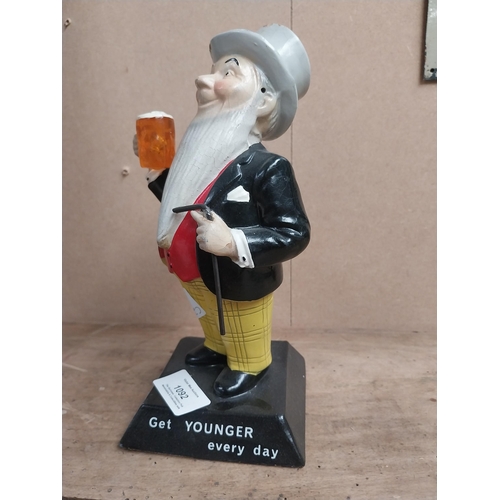 1092 - William Younger Ruberoid advertising figure. {22 cm H x 12 cm W x 10 cm D}.