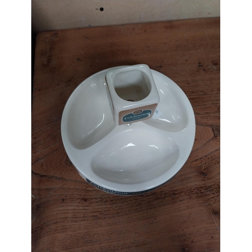 11 - Celebrations Ale ceramic advertising Ashtray and match strike by Wade. {14 cm H x 21 cm Dia.}.