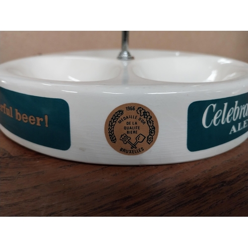 11 - Celebrations Ale ceramic advertising Ashtray and match strike by Wade. {14 cm H x 21 cm Dia.}.