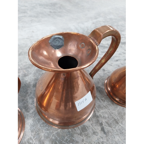 1115a - Set of six graduated copper measures. {17 cm H x 14 cm Dia. to 7 cm H x 8 cm Dia.}.