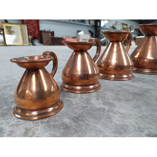 1115a - Set of six graduated copper measures. {17 cm H x 14 cm Dia. to 7 cm H x 8 cm Dia.}.