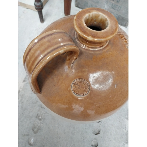 113 - 19th. C. stone ware whiskey flagon  - M. Mulvaney Hardware Wine and Spirit Merchant Mullagh Co Cavan... 