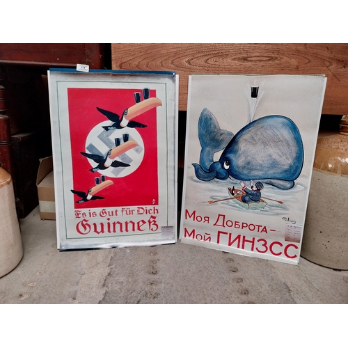 114 - Two Guinness advertising posters mounted on board - German Flying Toucans and Russian With Whale and... 