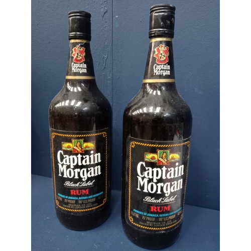 1150A - Two bottles Captain Morgan black label rum  {1 Litre }. - NOT AVAILABLE TO VIEW IN PERSON