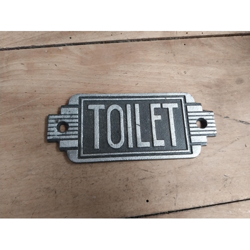 1154 - Two cast iron Toilet signs. {6 cm H x 14 cm W}.