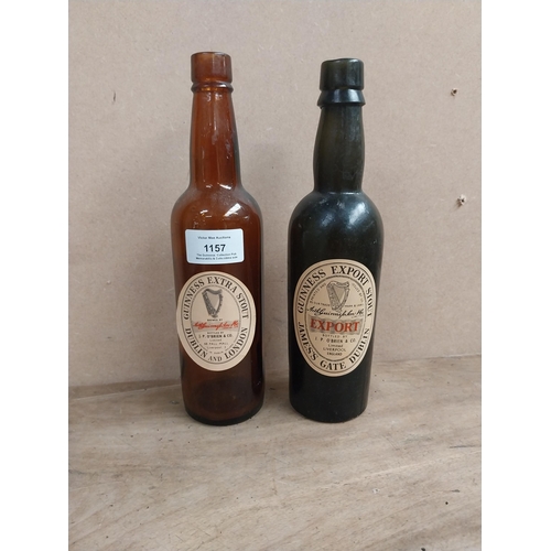 1157 - Two Guinness bottles - J P O'Brien Liverpool {23 cm H x 6 cm Dia}.