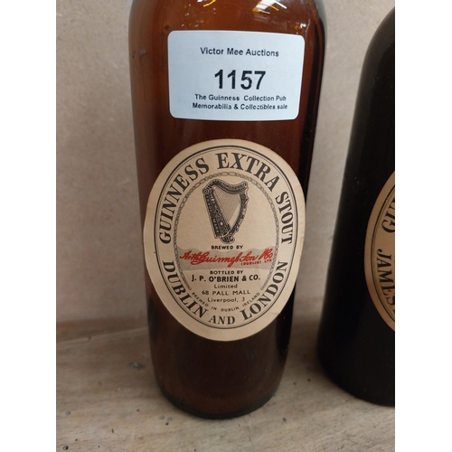 1157 - Two Guinness bottles - J P O'Brien Liverpool {23 cm H x 6 cm Dia}.