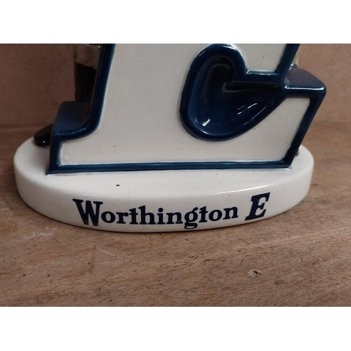 1270 - Worthington's Ale E ceramic Beswick advertising figural group. {24 cm H x 15 cm W x 5 cm D}.